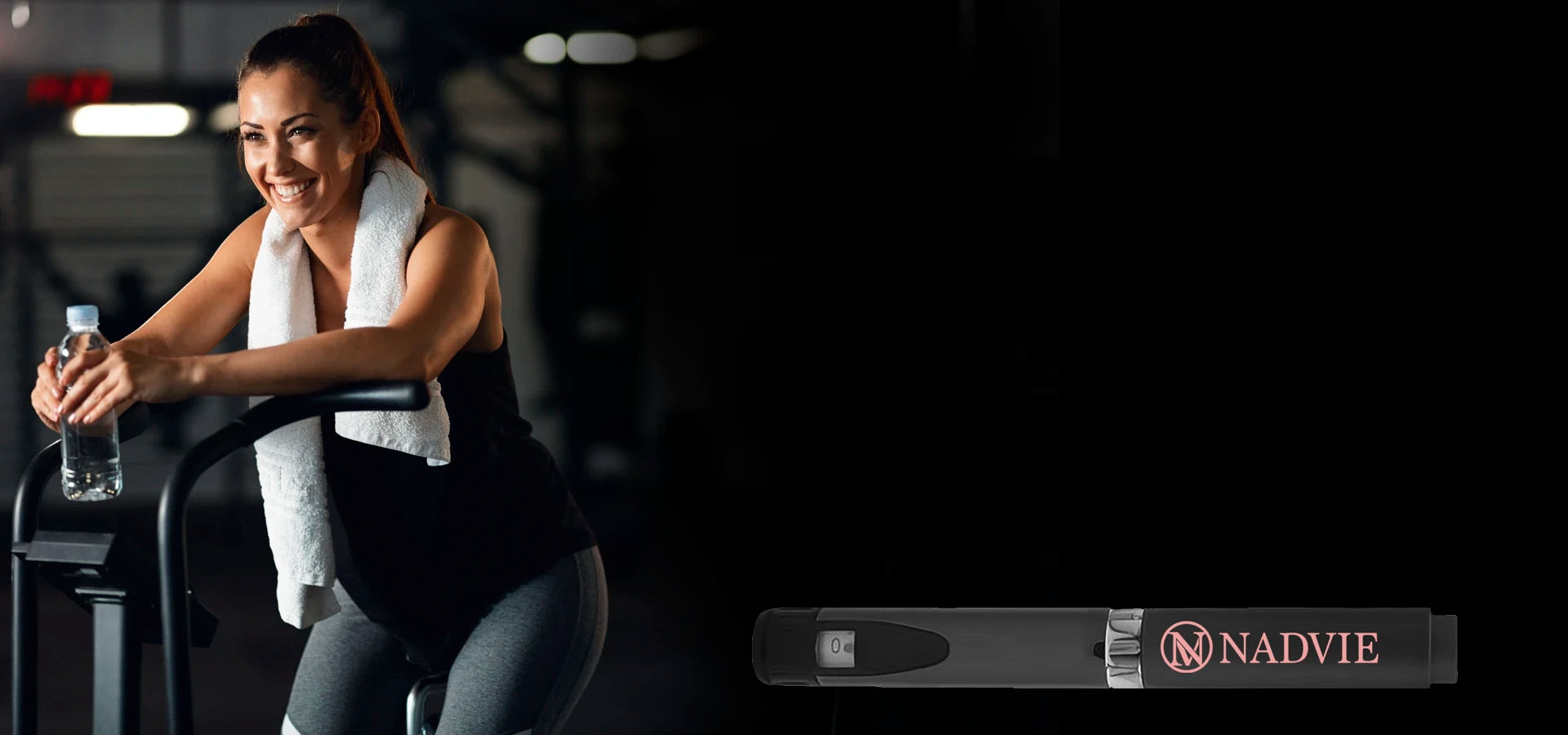 Woman exercising on stationary bike holding water bottle next to Nadvieslider_item_hyBn9K